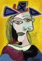 Woman's head in a blue hat with a red ribbon 1939 cubist Pablo Picasso